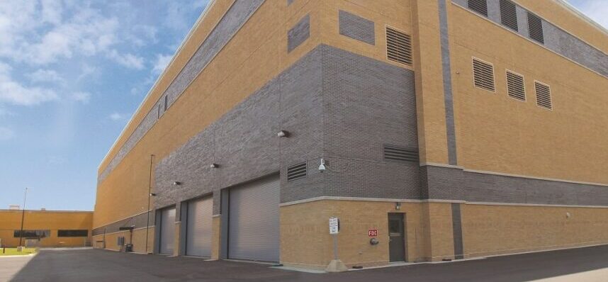 Exterior view of controlled-conditions facility with brick façade